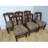 Set of six Victorian walnut dining chairs, the curved backs with incise decoration above over