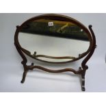 Edwardian mahogany toilet mirror, the oval plate with chequered edge stringing on scrolling cheval