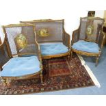 Satinwood bergère suite, c.1890's, comprising two seater settee & pair of armchairs, each with