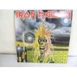 Iron Maiden by Iron Maiden LP (with black poly-lined inner) Vinyl EX. with one or two handling