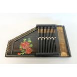 Late 19th century/early 20th century Auto harp zither the ebonised case with rose panel. 52cm