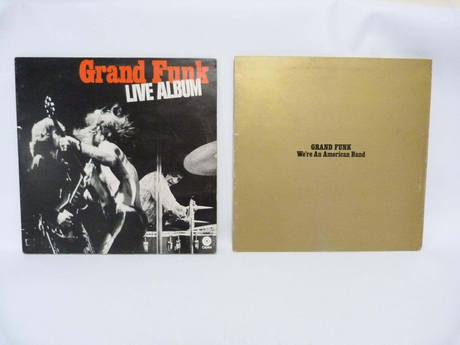 Two Grand Funk Railroad LP's to include Live Album and We're An American Band. Both UK first