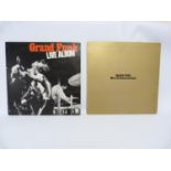 Two Grand Funk Railroad LP's to include Live Album and We're An American Band. Both UK first