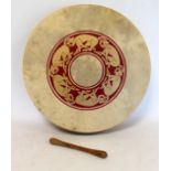 Modern Irish bodhran drum with painted Celtic decoration and wooden beater. 46cm diameter, with