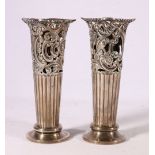Pair of Victorian silver spill vases with pierced scroll and foliate band by William Hutton & Sons