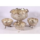 Indian silver coloured white metal pedestal bowl decorated with Buddha or Deities, 15cm diameter and