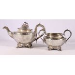 Victorian silver teapot and twin-handled sugar basket decorated with engraved foliate sprays and