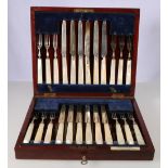 Cased set of twelve dessert knives and forks with mother-of-pearl handles and silver blades and
