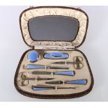 George V Art Deco silver and guilloché enamel eight-piece manicure set within fitted case by