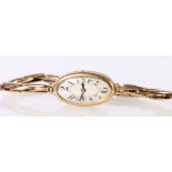 9ct yellow gold cased wristwatch with oval dial having 16 jewel movement on flexi link strap stamped