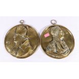 Pair of cast brass circular wall plaques depicting Nelson and Napoleon in profile, 17cm diameter.