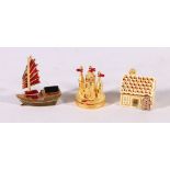 Three Estee Lauder perfume compacts in the form of a sailing boat (2003), gingerbread house (2001)