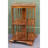 Mahogany and inlaid two tier revolving bookcase, raised on bracket supports, height 81 cm, width