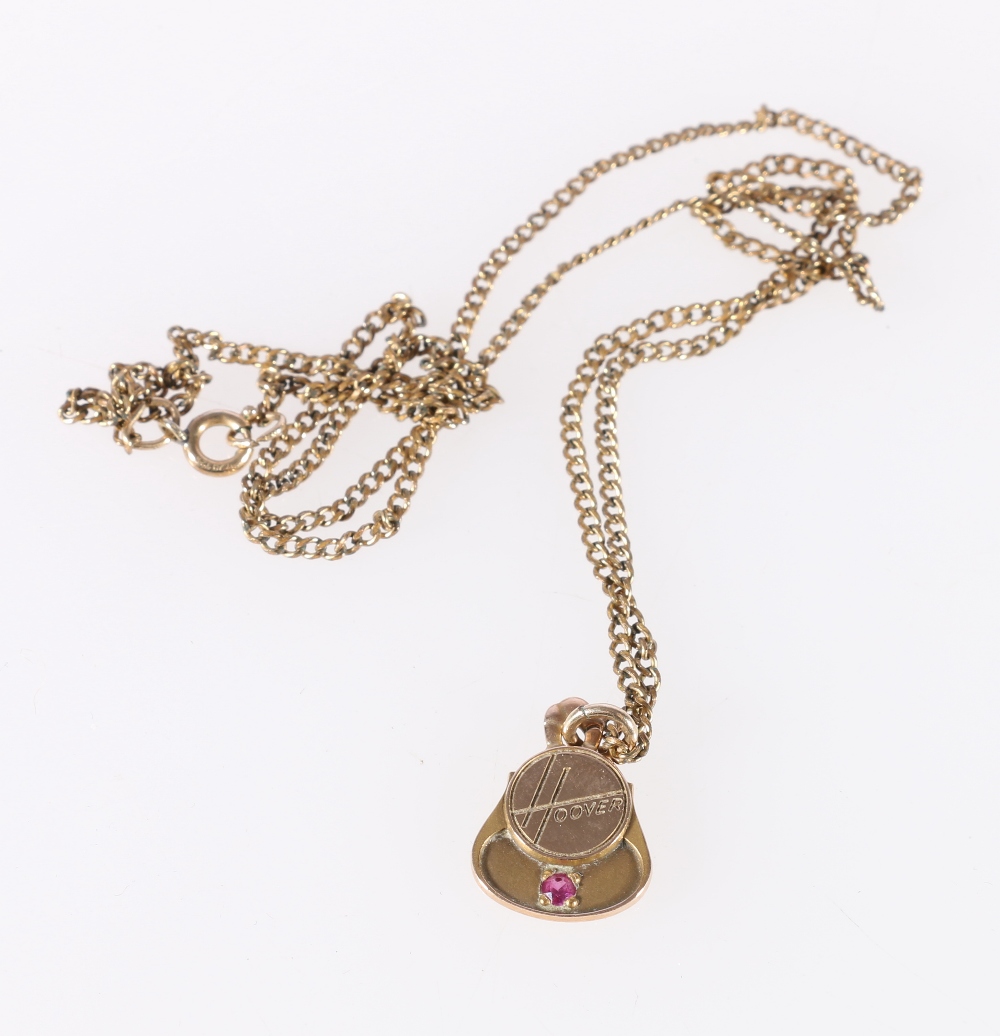 10K stamped 'Hoover' pendant set with ruby on rolled gold chain.