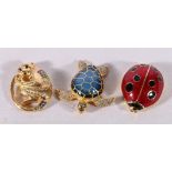 Three Estee Lauder perfume compacts in the form of a ladybird, monkey (2013) and turtle (2010),