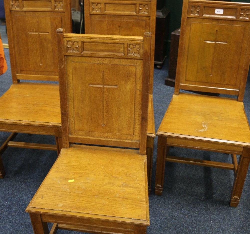 Set of four oak ecclesiastical side chairs with quatrefoil designs