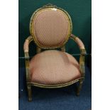 Reproduction carved open armchair with floral top rail, raised on reeded supports, 95cm tall.