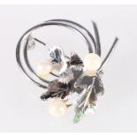Silver brooch set with three pearls in the manner of Mikimoto