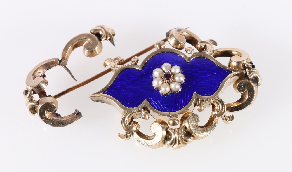 Victorian 9ct gold and blue enamel brooch set with central faceted ruby or garnet and arrangement of