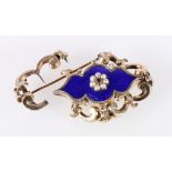 Victorian 9ct gold and blue enamel brooch set with central faceted ruby or garnet and arrangement of