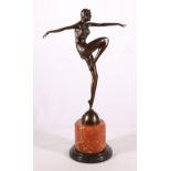 Contemporary Art Deco style bronzed figure of a dancer raised on marble column base, 56cm tall