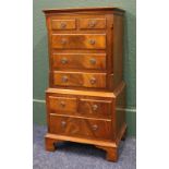 Flame cut mahogany multi drawer bedside chest raised on bracket supports, 77 cm high x 38 cm wide.