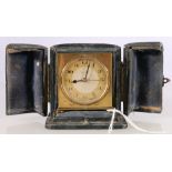 Zenith alarm clock in gilded brass case with leather travel case, 5.5cm tall