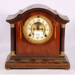 Mahogany and inlaid art nouveau mantel clock with visible escapement, 29cm wide.