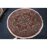 Persian mat floral mediation, over red floral ground, triple border, 100 cm diameter.