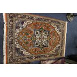 Persian rug, central form mediation over orange ground floral design, 148 x 98 cm.
