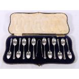 Set of twelve Edward VII Art Nouveau silver teaspoons and tongs London 1907 by Josiah Williams &