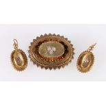 Suite of Victorian gilt metal jewellery of cog form comprising brooch and pair of earrings, each