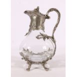 Contemporary clear glass wine ewer with white metal mounts and supports, 24cm tall