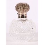 Contemporary spherical cut glass scent bottle with silver rim and top by Camelot Silverware Ltd,