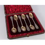 Set of six Victorian silver teaspoons with filigree terminals and gilded bowls Birmingham 1884,