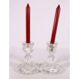 Pair of Baccarat French clear glass candlesticks of gadrooned form, Baccarat France mark to base,