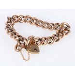 9ct gold curb link bracelet with heart lock closure, 24.2g