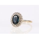 9ct yellow gold diamond and central faceted sapphire flowerhead ring, 3.4g, size J.