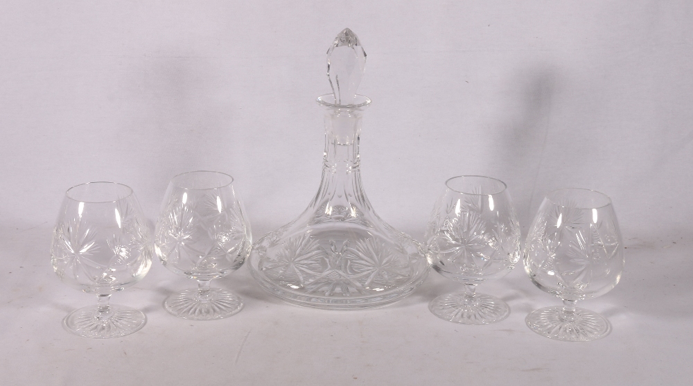 Cut crystal ship's style decanter and four brandy glasses with fern decoration