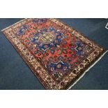 A Tiafresh rug, central medallion, one pink ground blue floral triple border, 206 x 137 cm.