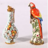 Two Halcyon Days Enamels perfume bottles, one in the form of a bird of paradise the other of tear