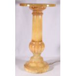 Marbled soapstone pedestal with lit interior, 59cm tall