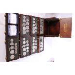 Danbury Mint British Coins of World War II collection in multi-drawer cabinet (four missing coins)