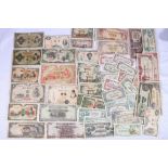 A collection of Japanese banknotes including 100 yen (block 3), convertible silver one yen c1916,