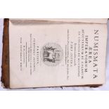 Two antique coin books including Numismata Aerea Imperatorum Augustarum Et Municipiis 1688 and