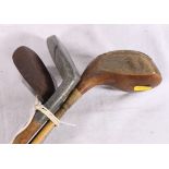 Four golf clubs including Imperial Golf Company Flat XX putter, Tom Watt magic machie niblick,