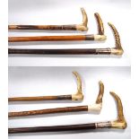 Six horn-handled riding crops of various designs.   (6)