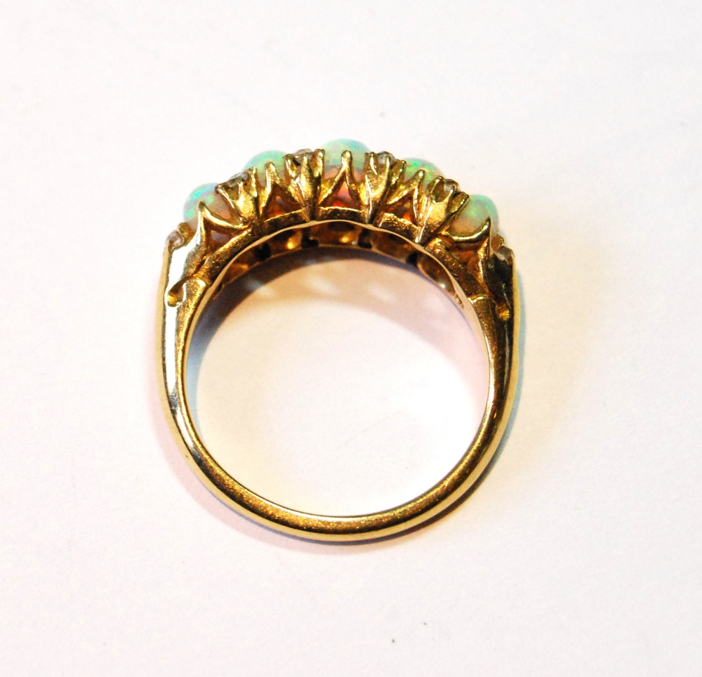 Edwardian gold half hoop ring with five opals and diamond points, in gold, probably 18ct, size L. - Image 2 of 3