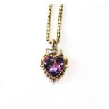 9ct gold heart locket with amethyst, 1893, on a snake necklet.