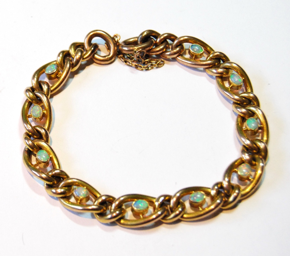 Gold bracelet of curb pattern with oval opal collets, '9c', 13g.